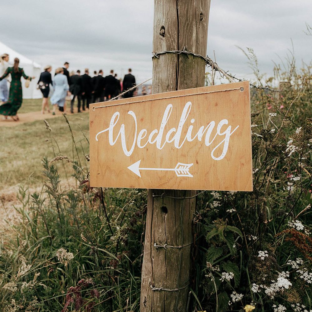 Wooden wedding signage complete with white writing 