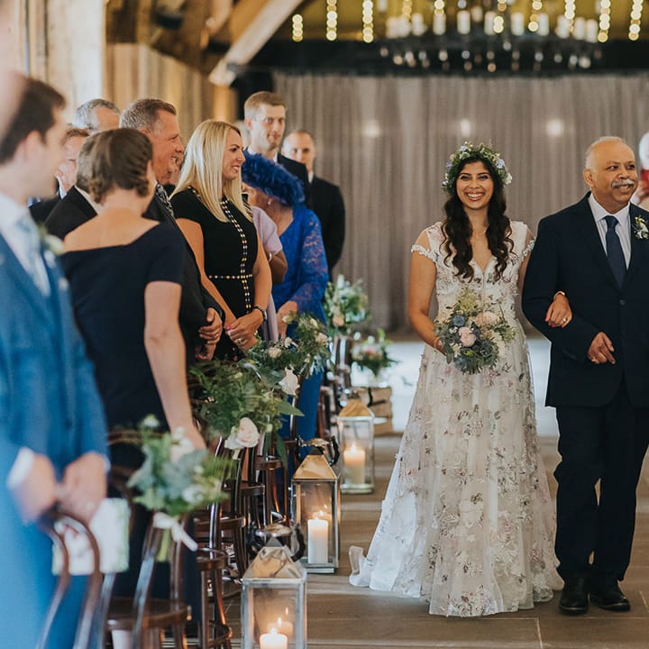 father of the bride walking his daughter down the aisle at The Tithe Barn Bolton Abbey