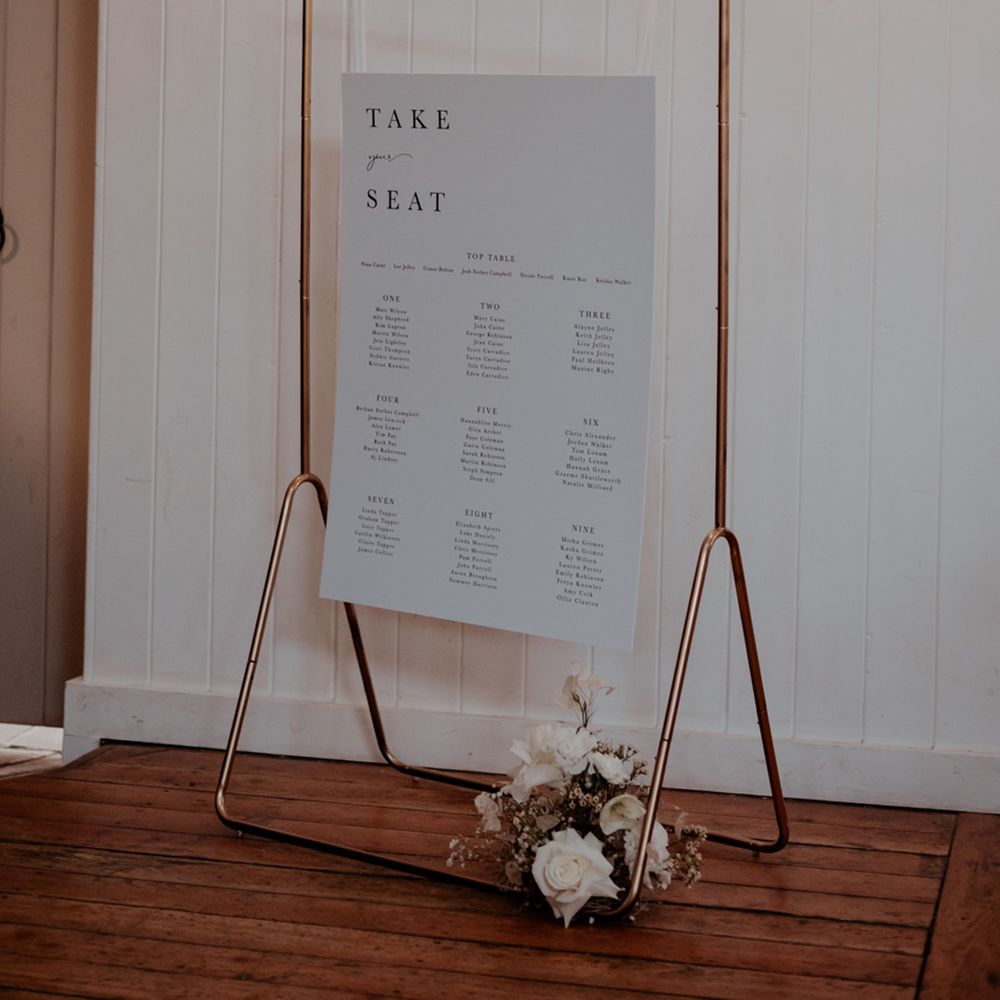 Black and white simple and minimal wedding seating chart for traditional wedding 