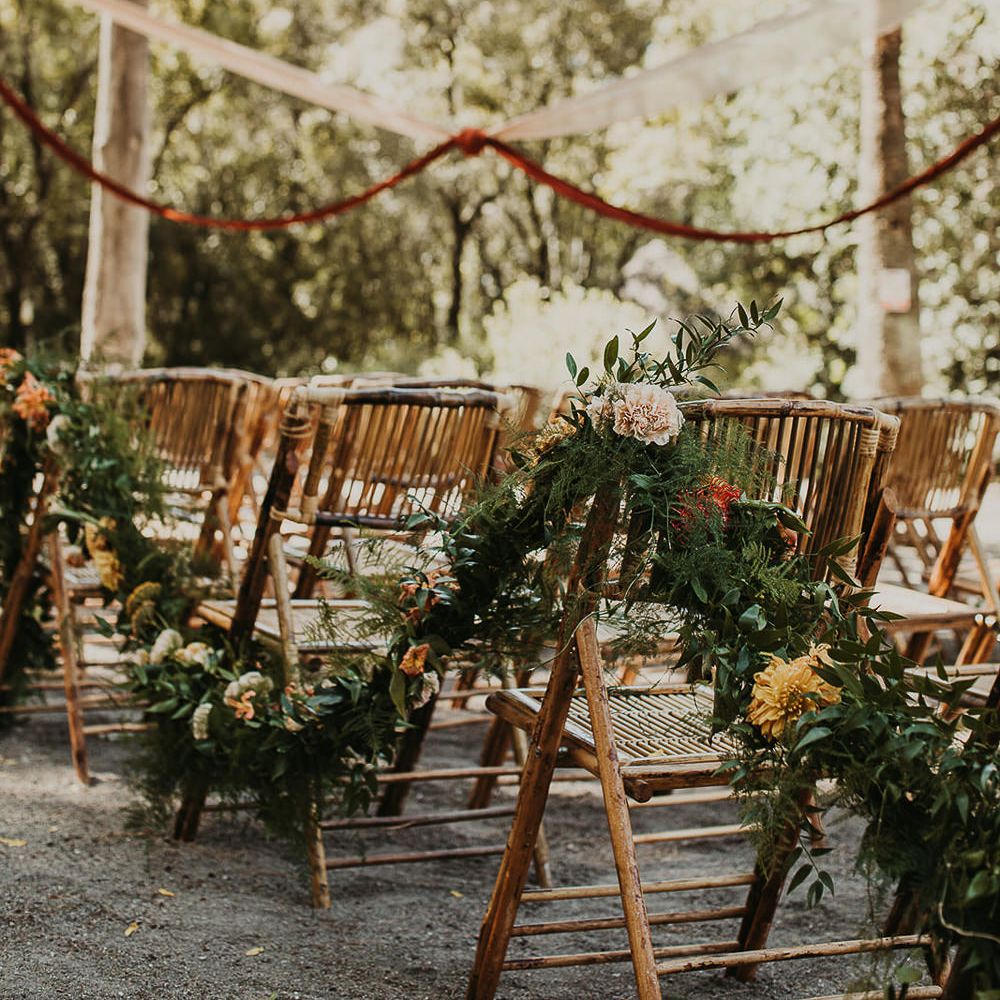 Floral garland decorating the aisle chairs