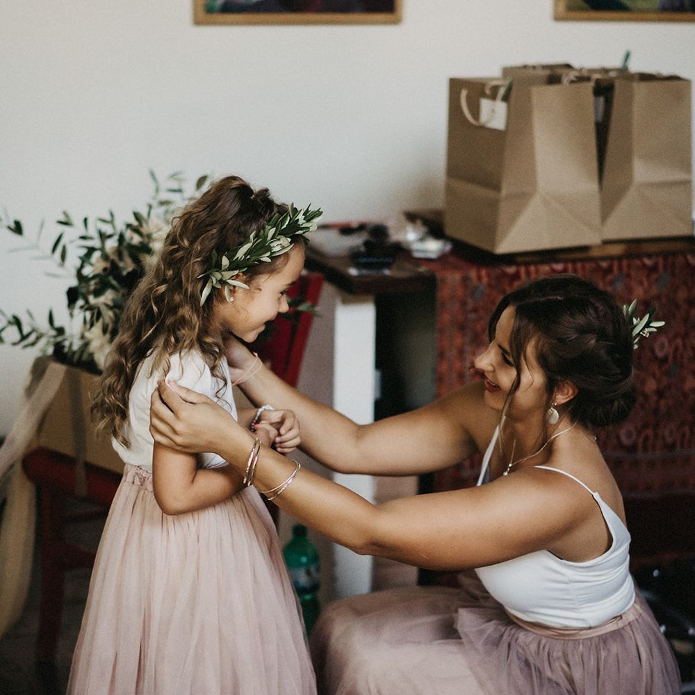Flower girl wearing olive bouquet headband crown