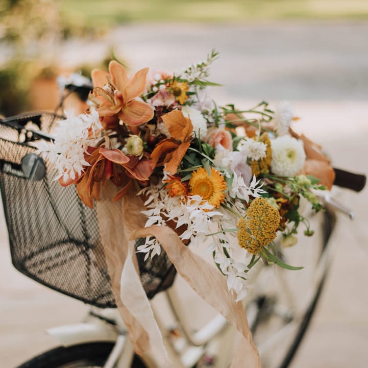 Autumn wedding flower display in a vintage bike basket