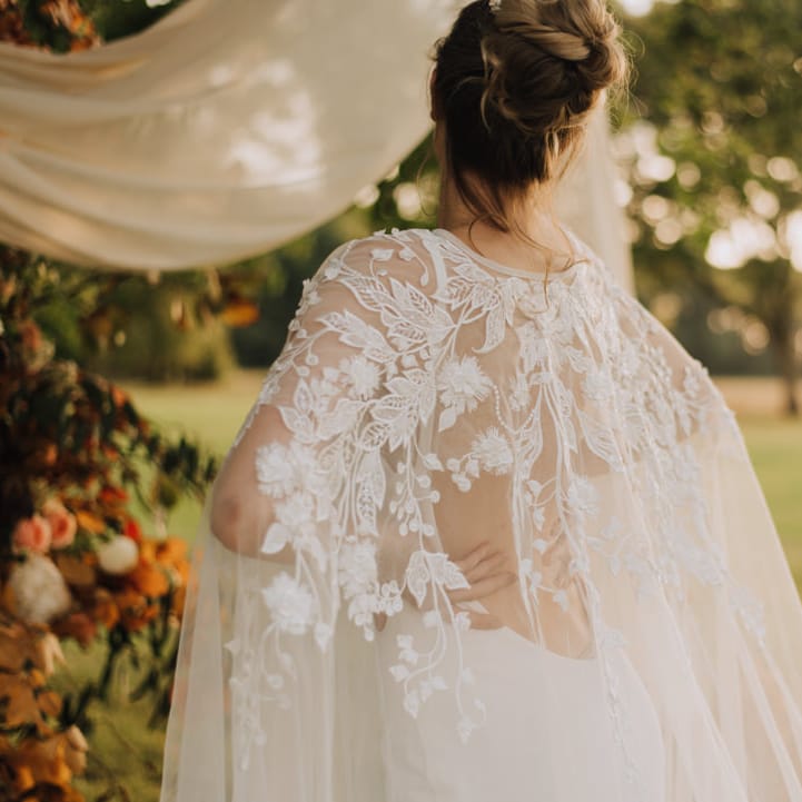 Lace details on bridal cape