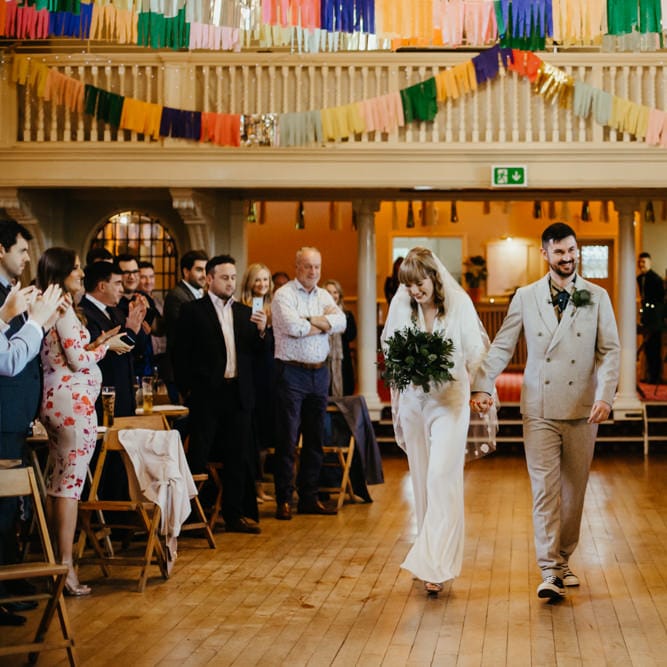Bride and groom entering the humanist ceremony together 