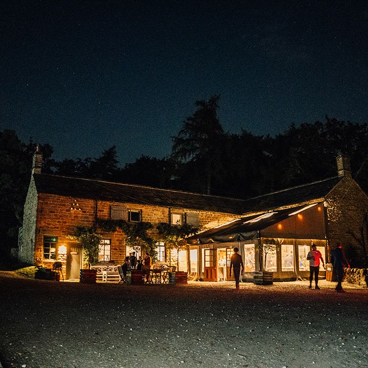 Tipi lit up at night outdoors