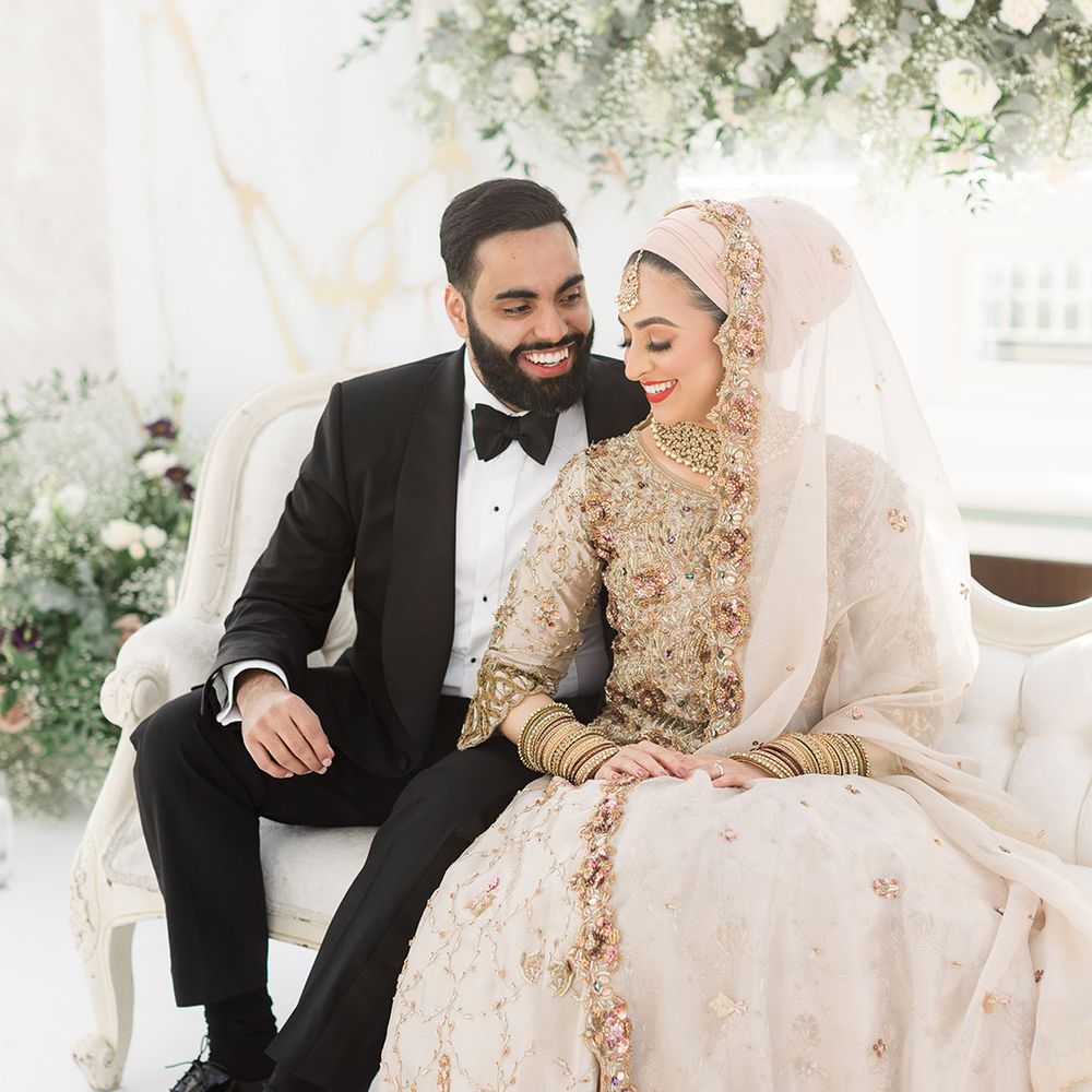 Bride & groom sit with one another at the Isla Gladstone Conservatory for Walima 