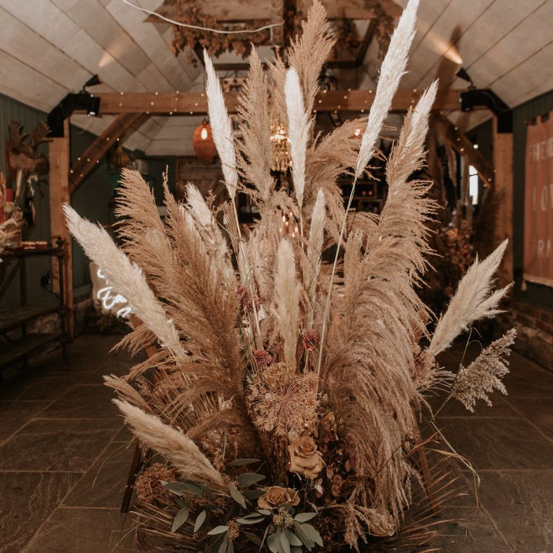 Huge pampas grass centrepiece for wedding reception