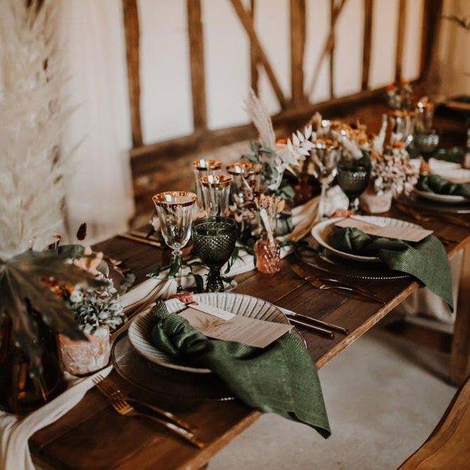 Emerald green glassware and napkins for rustic barn wedding 
