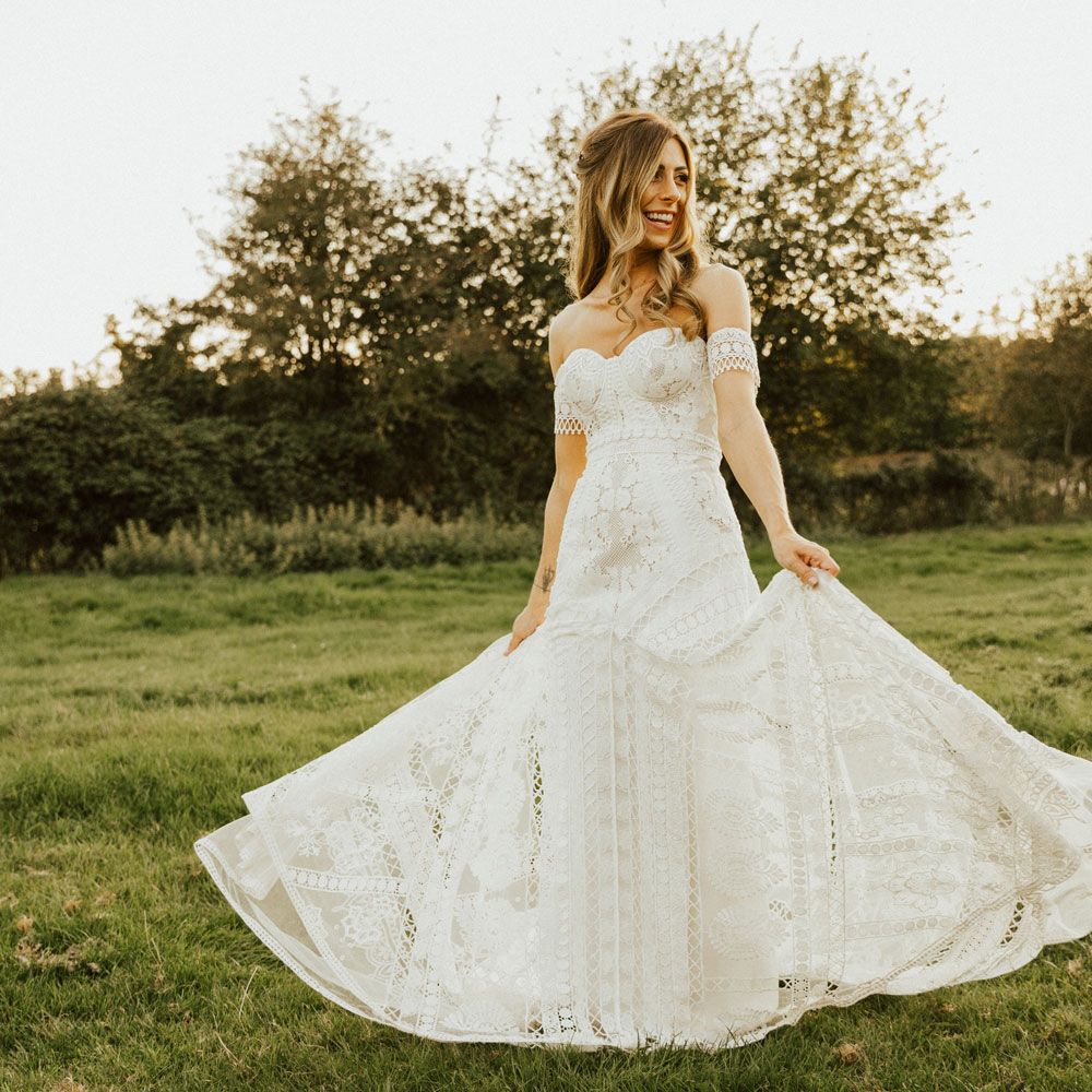 Bride twirls outside in Clara Rue De Seine wedding dress at Tythe Barn Wedding