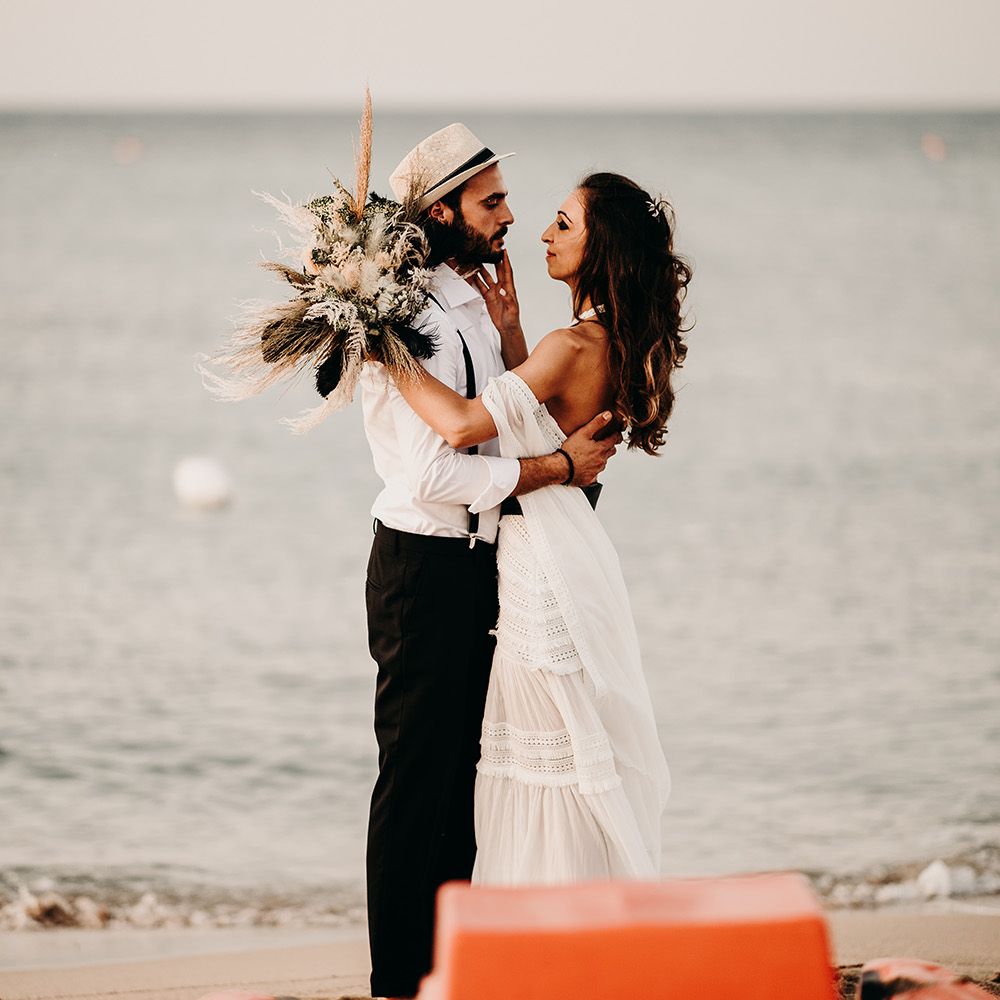 Bride clutches pampas grass bouquet at Puglia wedding