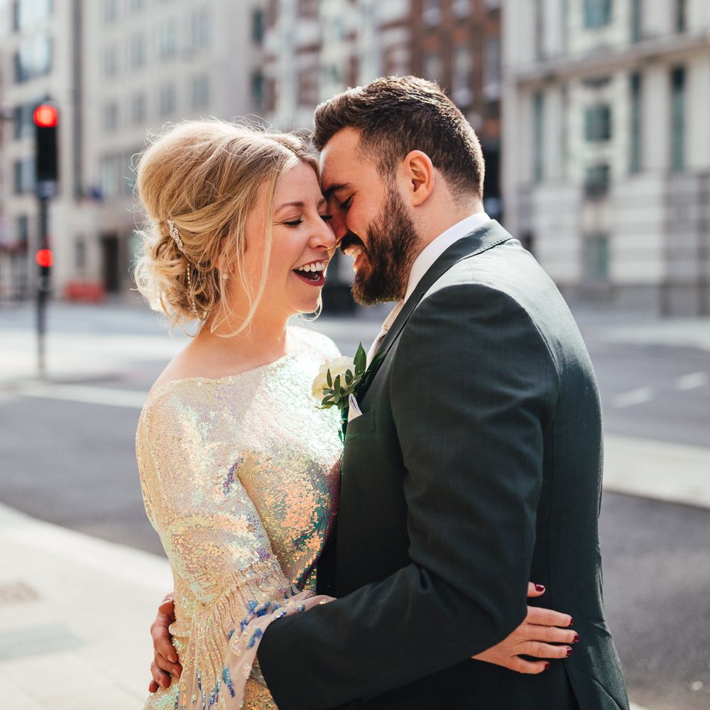 Bride & groom kiss in London