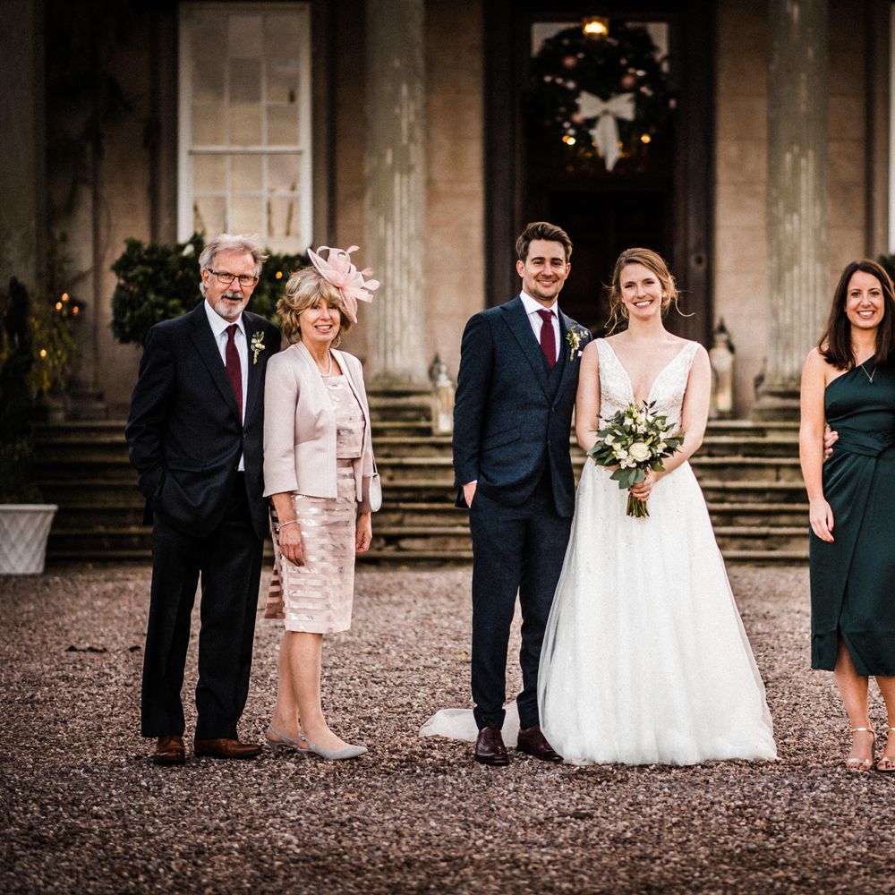 Socially distanced photos with wedding guests outdoors