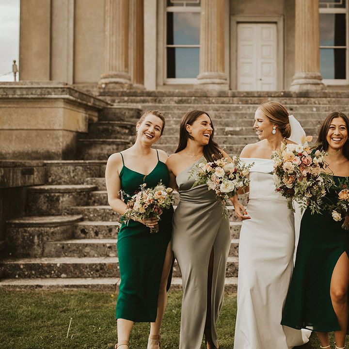 Bride stands with her bridesmaids on her wedding day