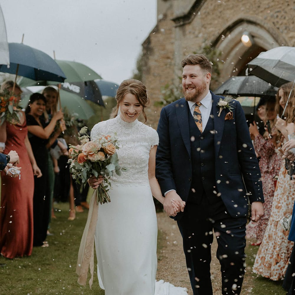 Confetti moment for bride and groom at church ceremony