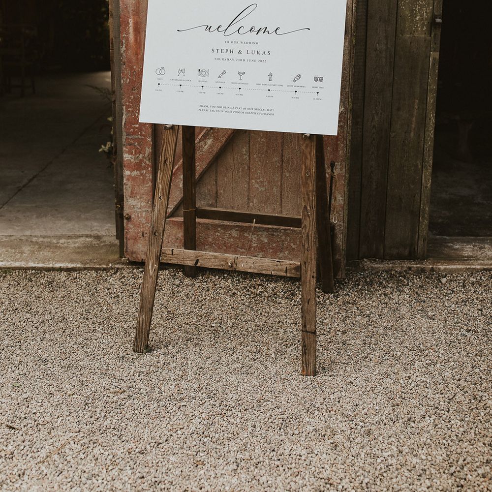 Simple and minimal black and white wedding welcome and order of the day sign 