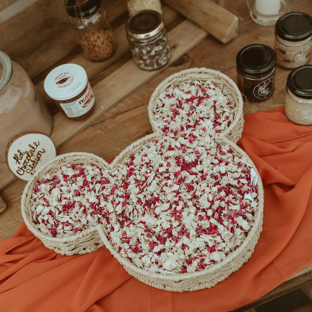 Mickey Mouse shaped bowl full of confetti on the table for the chocolate station