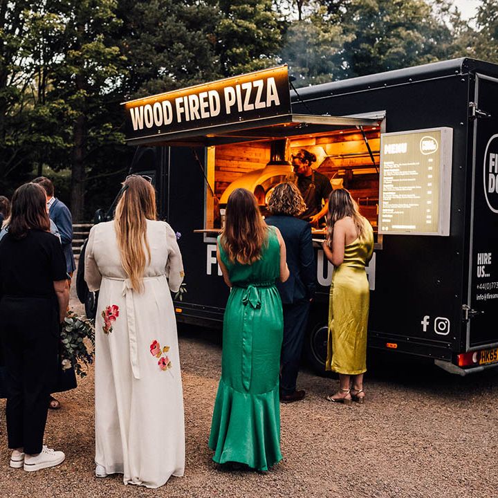 Outdoor wood fired pizza wedding food idea for relaxed and laid back boho wedding 
