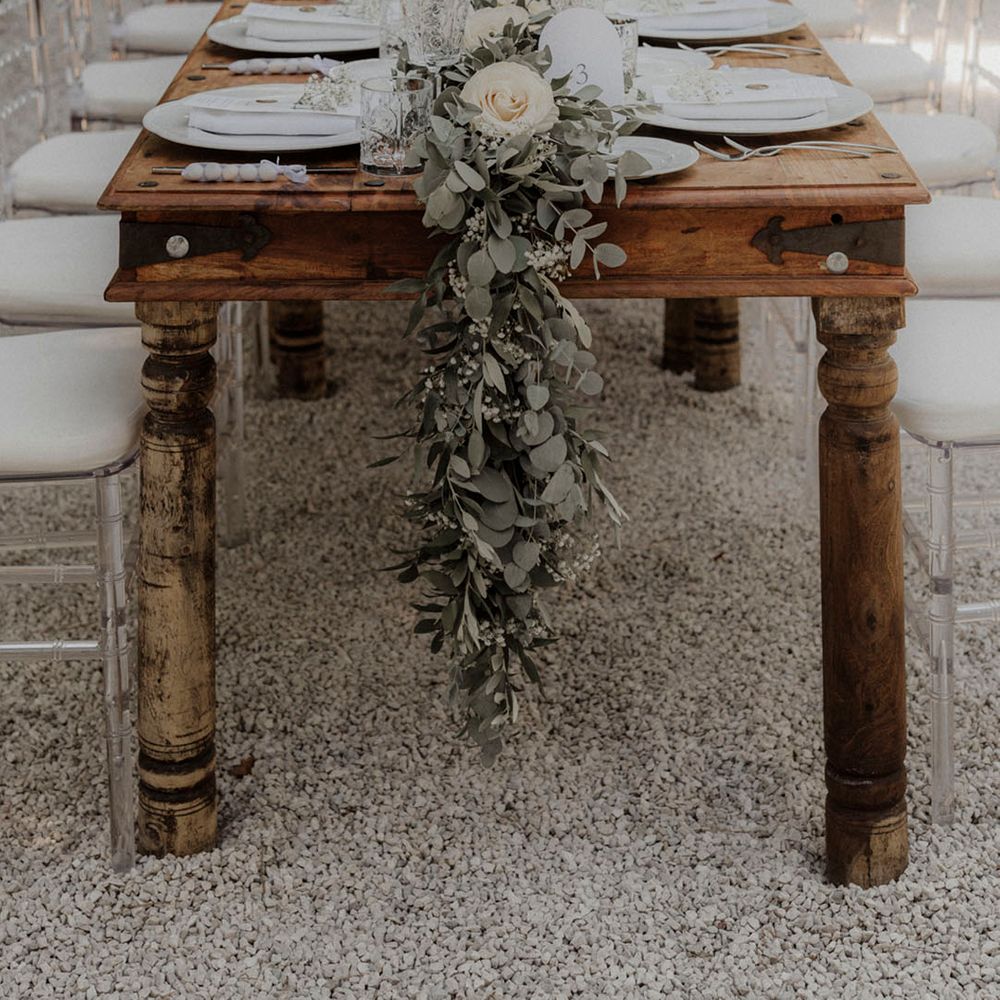 Simple and minimalist wedding tablescape with foliage for rustic al fresco dining at dinner party wedding 
