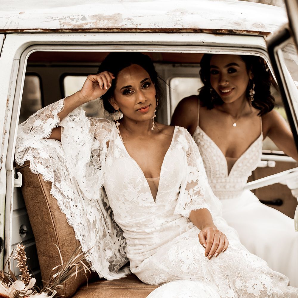 Indian bride in a lace boho wedding dress with batwing sleeves 