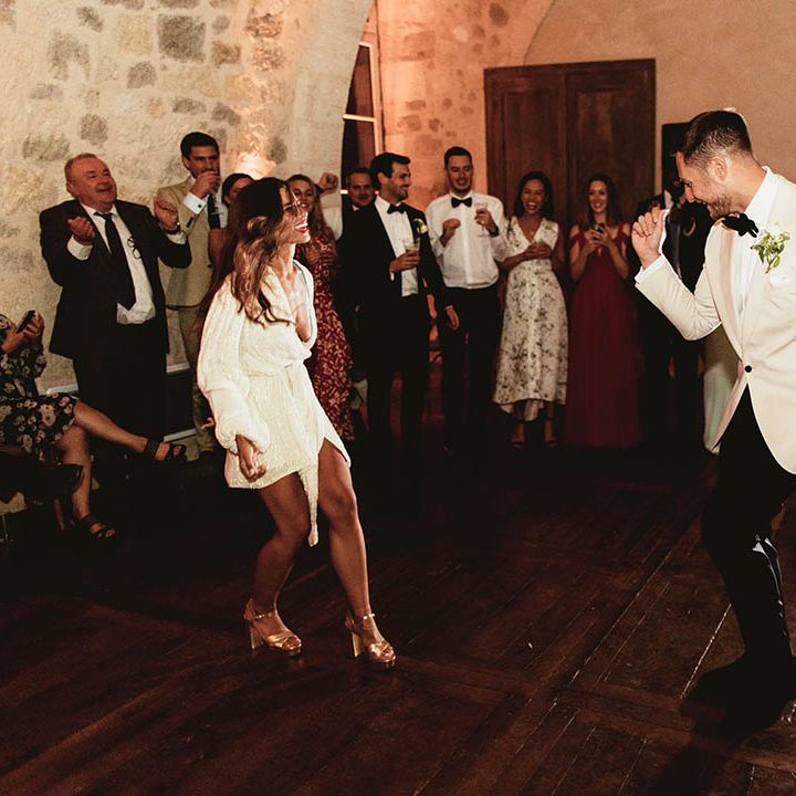 Bride wears short sequinned wedding dress for reception party