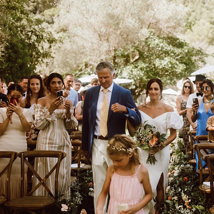 Father of the bride walks bride down the aisle 