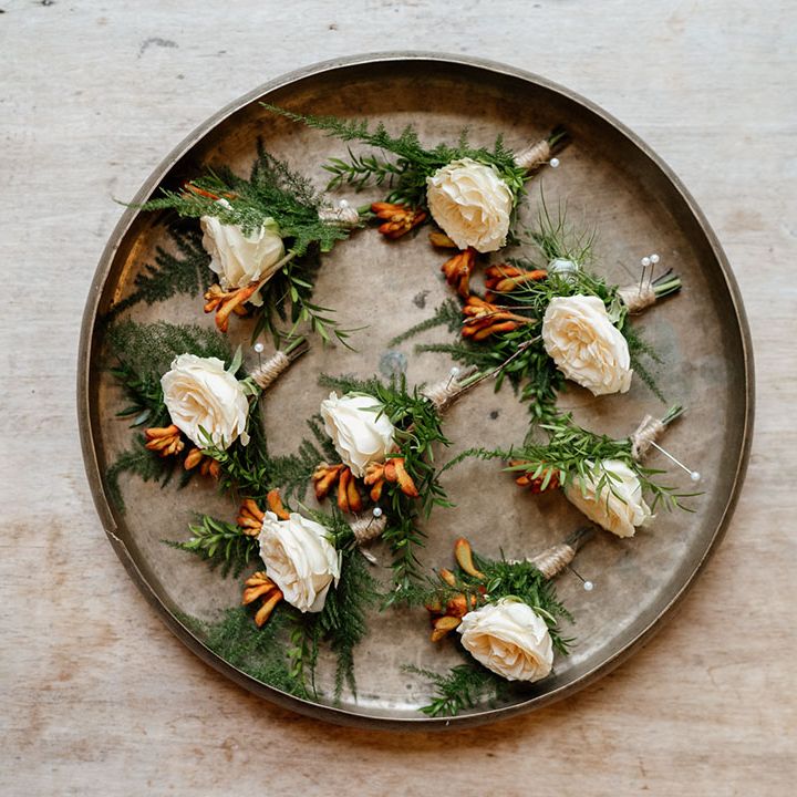 White flower buttonholes for groom and groomsmen