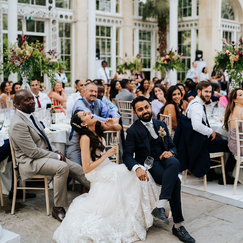 Bride & groom laugh during reception at Syon Park 