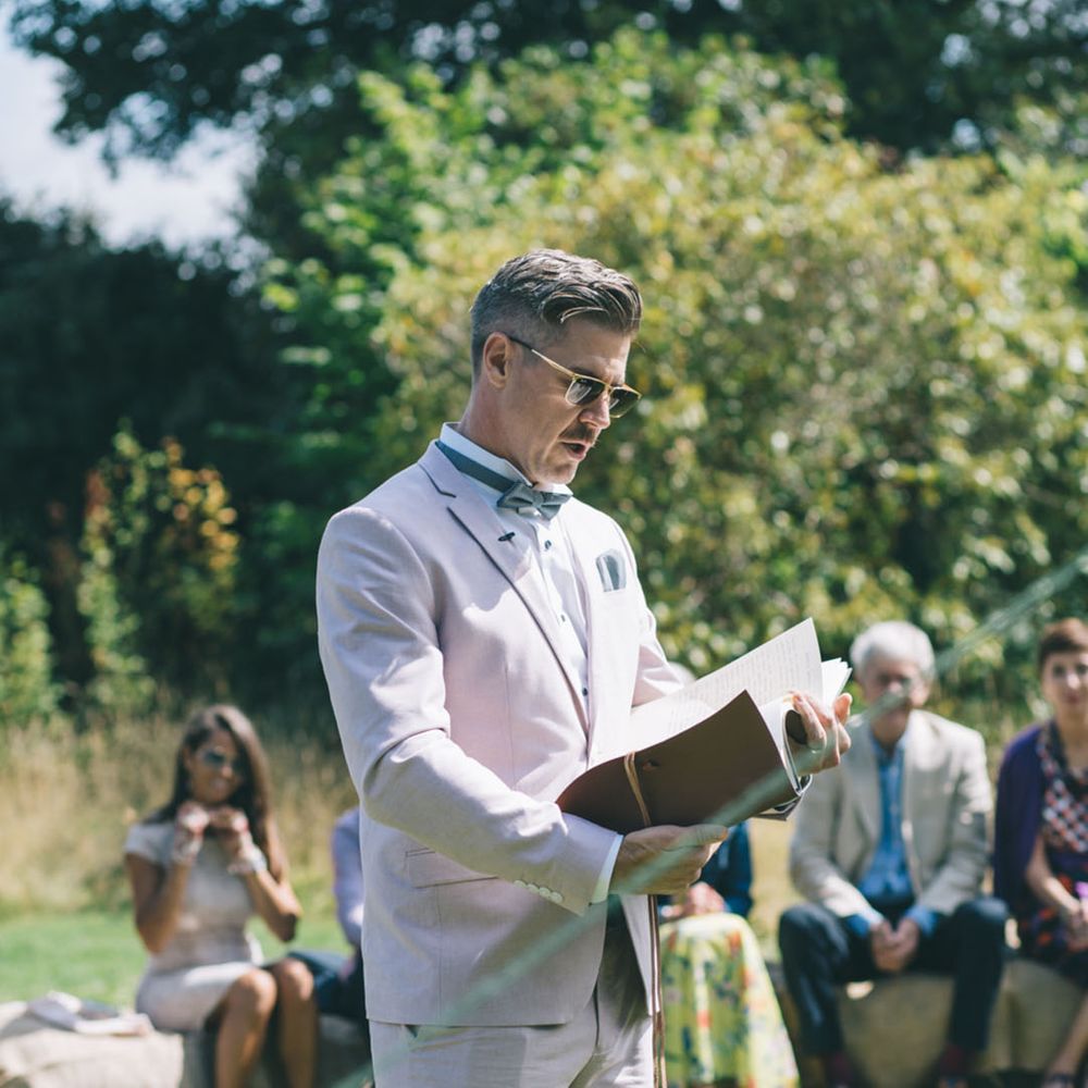 Wedding guest gives a wedding reading during the ceremony 