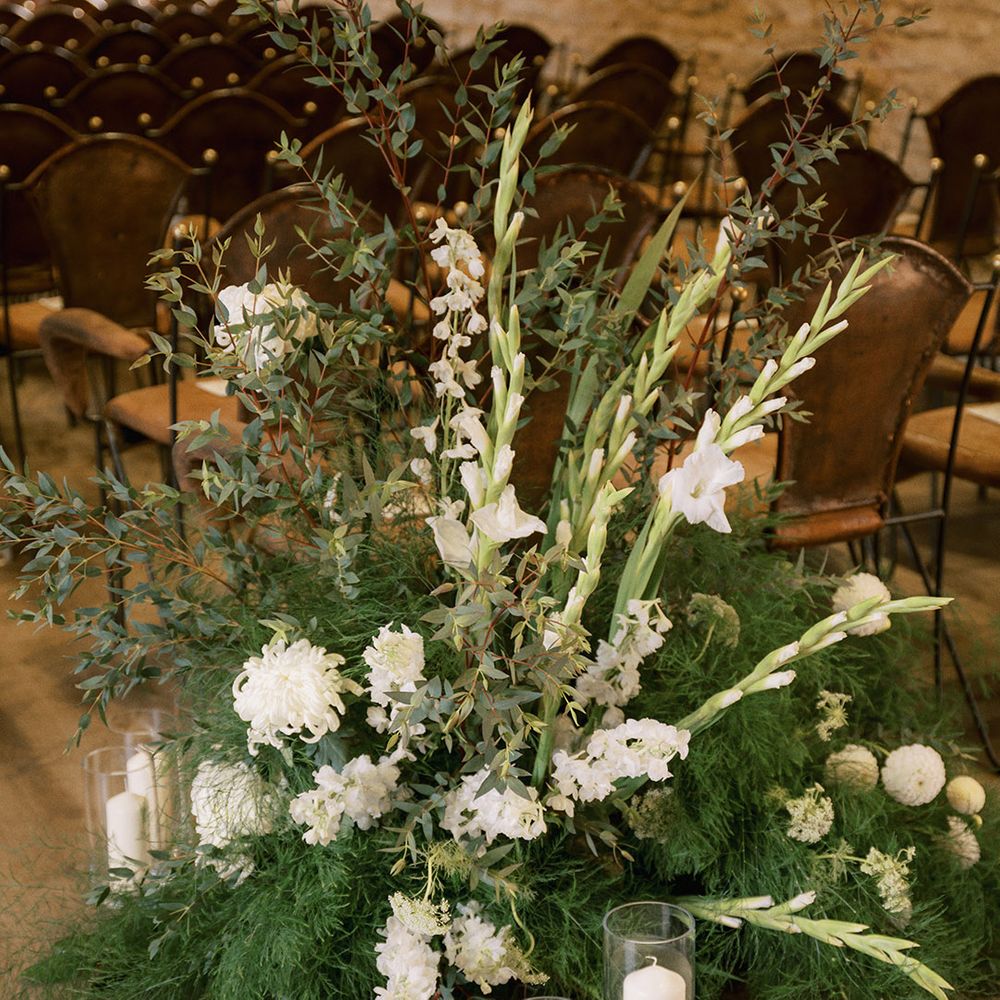 Dahlias, chrysanthemum, and gladiolus white wedding flower aisle decoration for rustic luxe wedding 