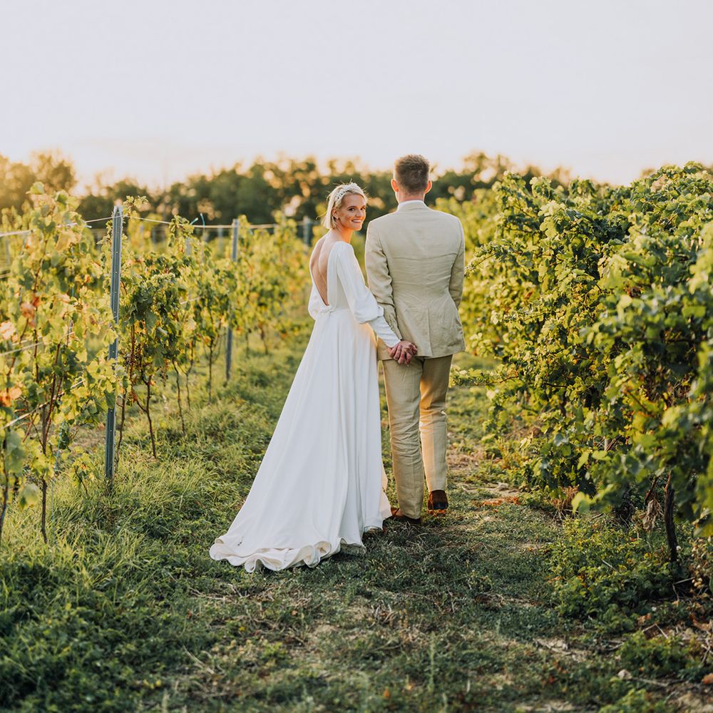 Bride and groom wedding photographs in a vineyard at Château de Malliac wedding venue, France