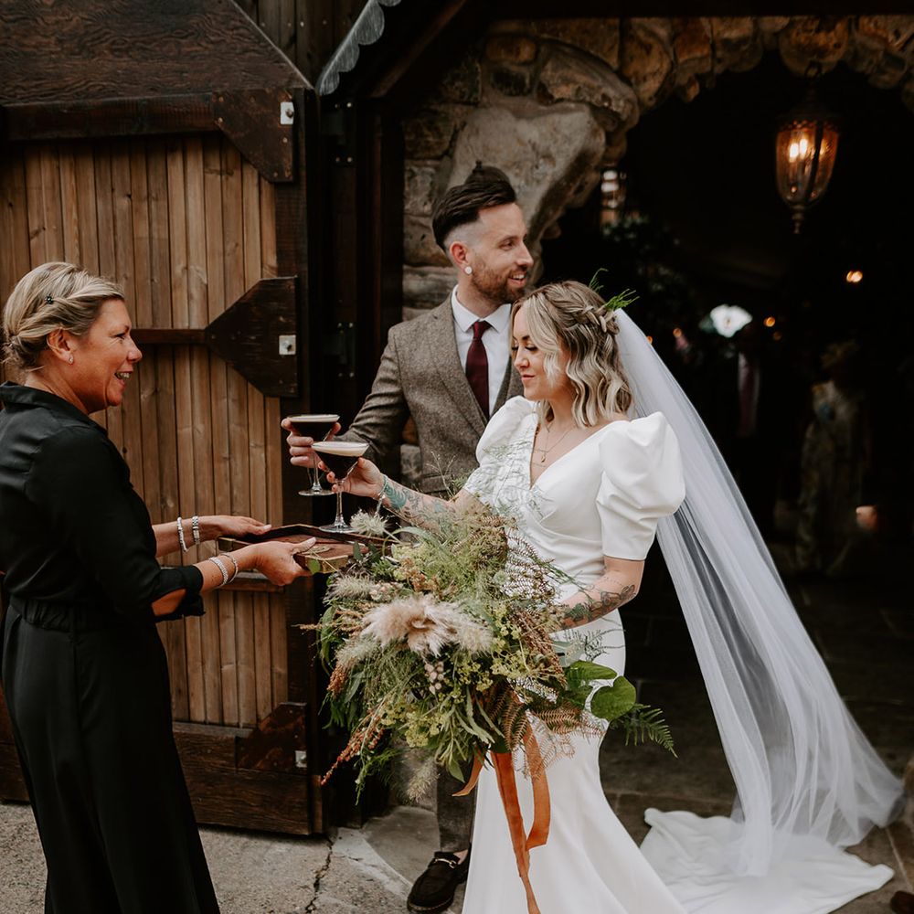 The bride and groom have their first official drink as a married couple as they pick up some espresso martinis 