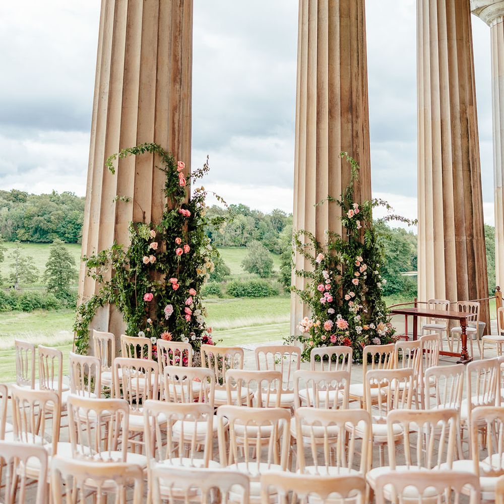 The Grange in Hampshire with pink wedding flowers decorating the altar 