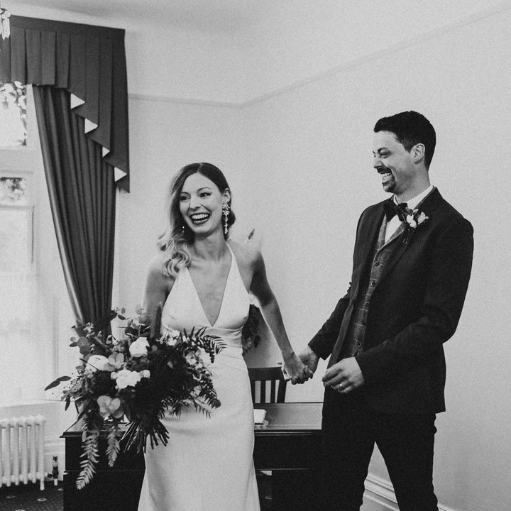 Black and white portrait of bride and groom just married