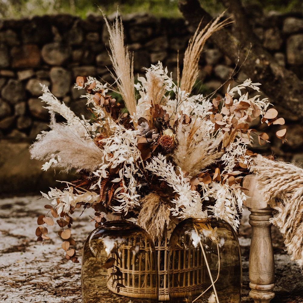 Large dried flowers bouquet in wicker vase