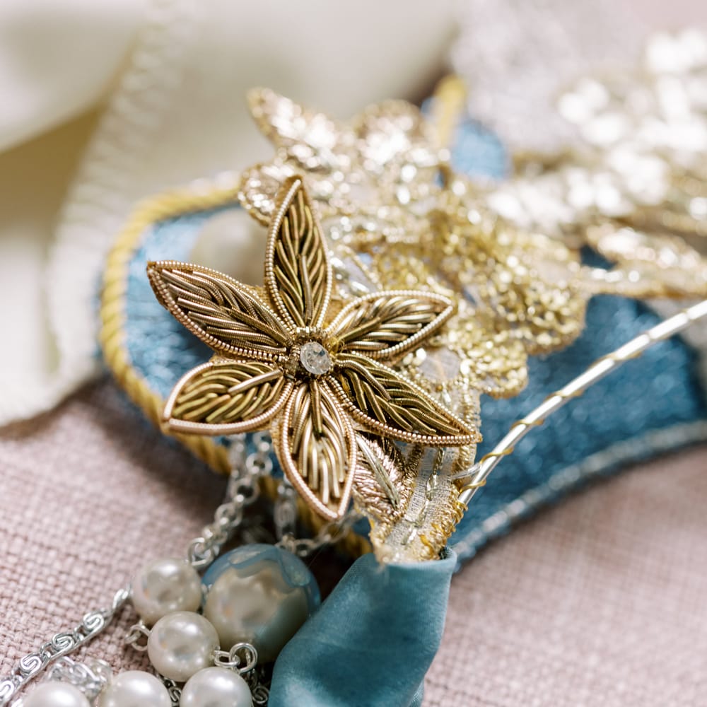 Golden and intricate hair accessory with diamanté centre 