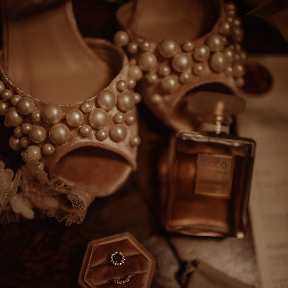 Bridal accessories with pearl Charlotte Mills Shoes, engagement ring and wedding perfume 