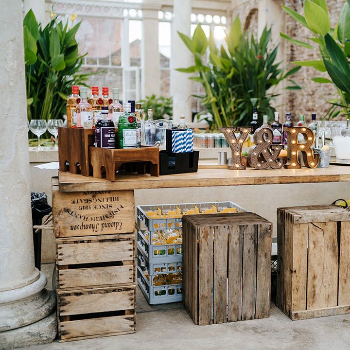 Wooden cocktail bar with rustic vibe complete with light up personalised initials 