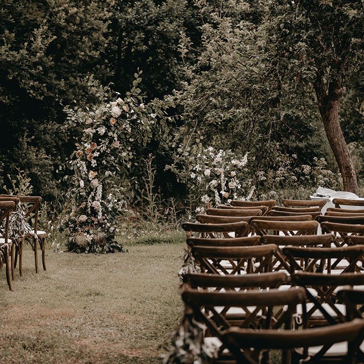 Outdoor wedding ceremony at Anran with flower column altar decor 