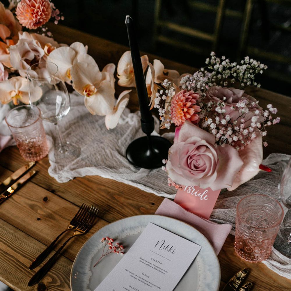 Luxury neutral wedding tablescape with ceramic plate, tulle fabric table runner, rose and peony and baby's-breath table centrepieces 