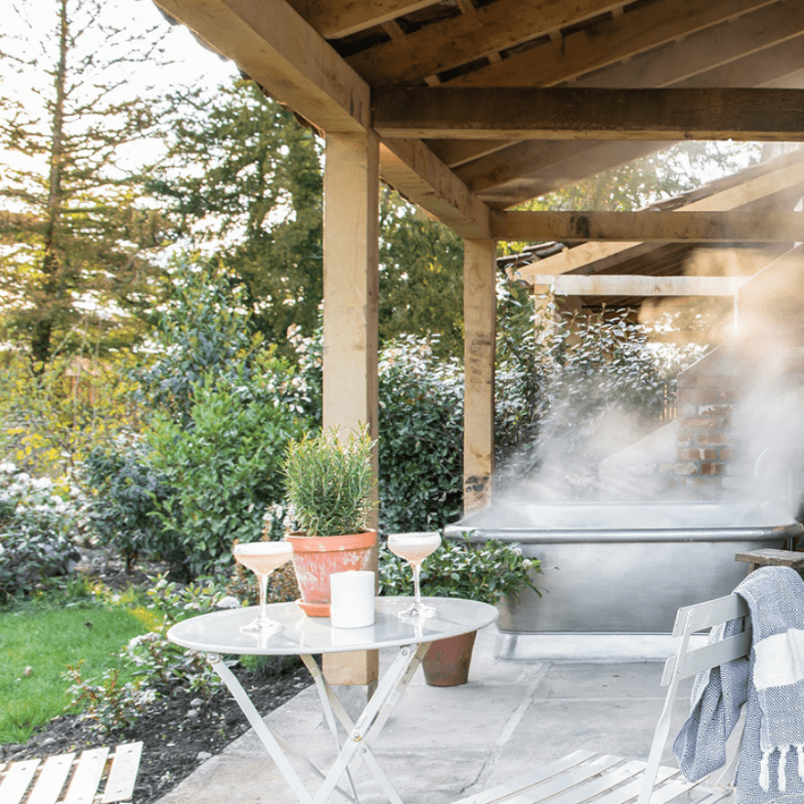 Image of steaming bath spa on a terrace with table and chairs at Middleton Lodge Estate