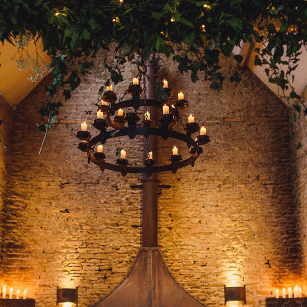 Stone Barn wedding venue with cosy warm lighting and candles for winter weddings 