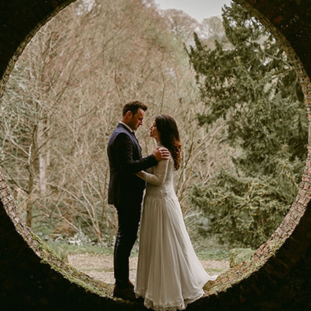 Unique circle backdrop for wedding ceremony at country house wedding venue 