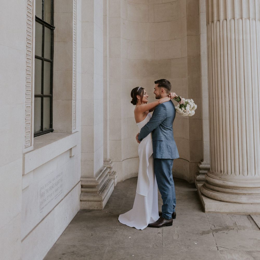 Bride and groom portrait with bride in Roland Mouret wedding dress 