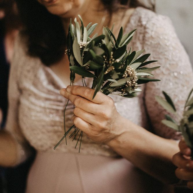 Guest holding Olive bouquet favours