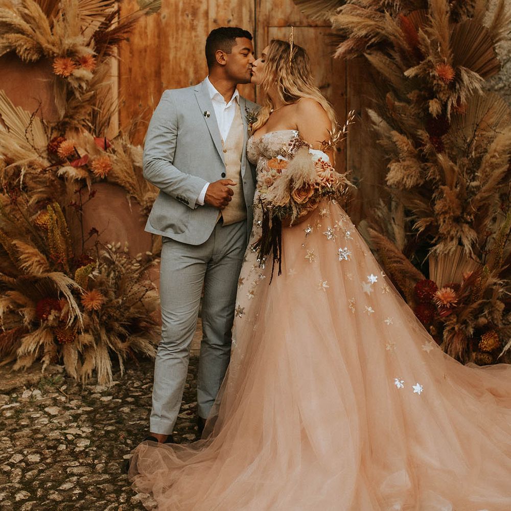 Bride & groom kiss on their wedding day
