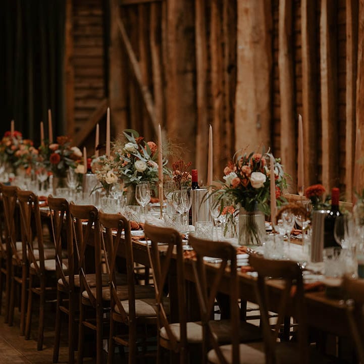 Rustic autumn wedding with flower decor and long wooden tables