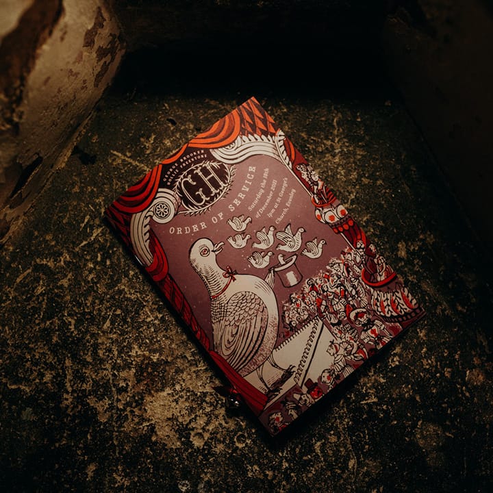 DIY order of service with Christmas theme, red and white colour palette and vintage drawing style