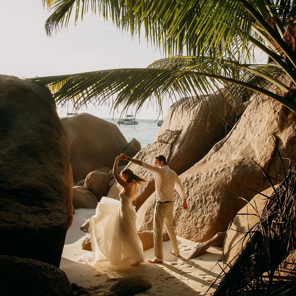 Bride and groom dancing on the beach at Seychelles elopement