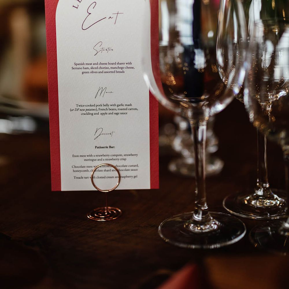 Orange and white wedding menu for the wedding breakfast at Botley Hill Barn wedding venue 