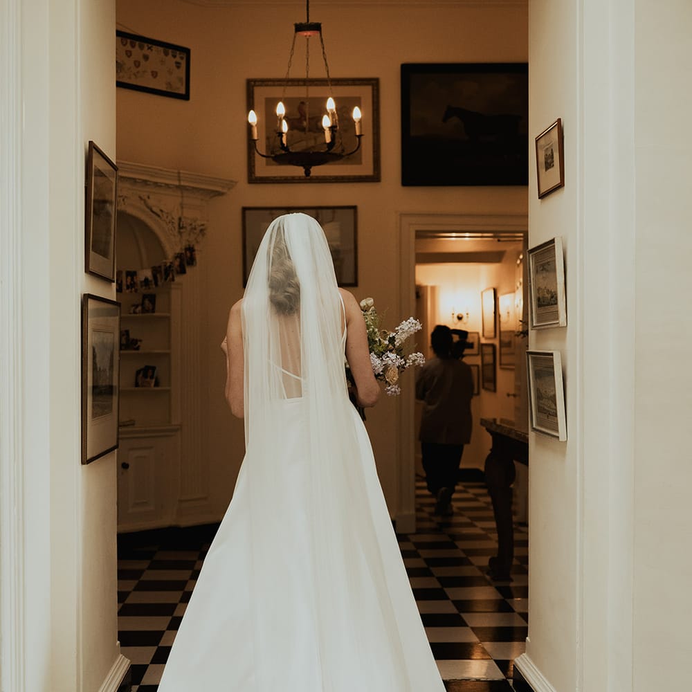 Bride in traditional wedding dress with wedding veil 